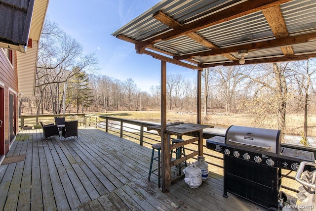 12109 Shaffer Rd, Davisburg, MI 48350 - wooden terrace featuring area for grilling and view of wooded area