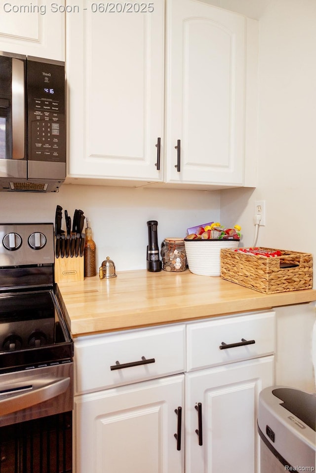 632 S Edison Ave, Royal Oak, MI 48067 - kitchen with appliances with stainless steel finishes and white cabinets
