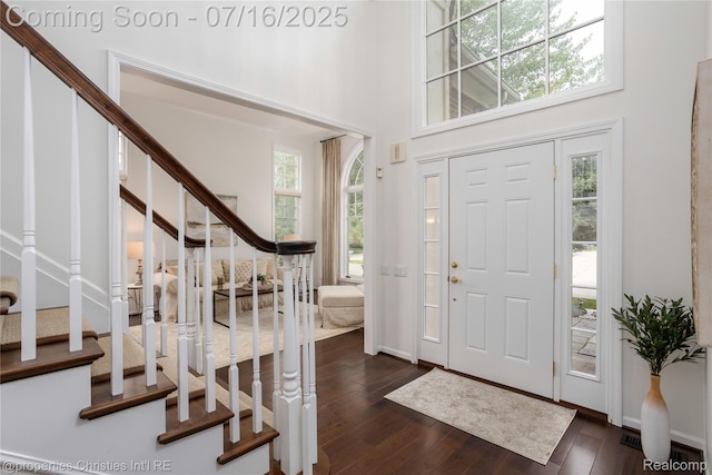 22080 Chase Dr, Novi, MI 48375 - foyer entrance with plenty of natural light, stairs, dark wood-style floors, and a high ceiling