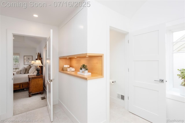 22080 Chase Dr, Novi, MI 48375 - hallway with healthy amount of natural light, recessed lighting, and light tile patterned floors