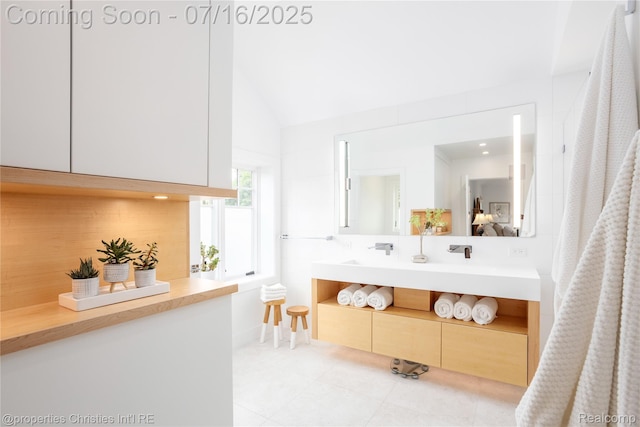 22080 Chase Dr, Novi, MI 48375 - full bath featuring vanity, tile patterned floors, and lofted ceiling