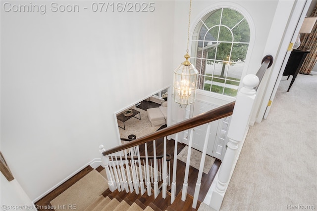 22080 Chase Dr, Novi, MI 48375 - staircase featuring carpet floors and a chandelier