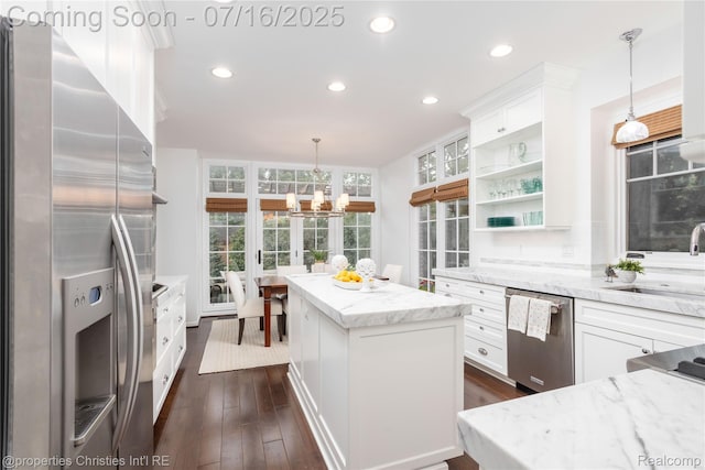 22080 Chase Dr, Novi, MI 48375 - kitchen with stainless steel appliances, a center island, white cabinetry, open shelves, and recessed lighting