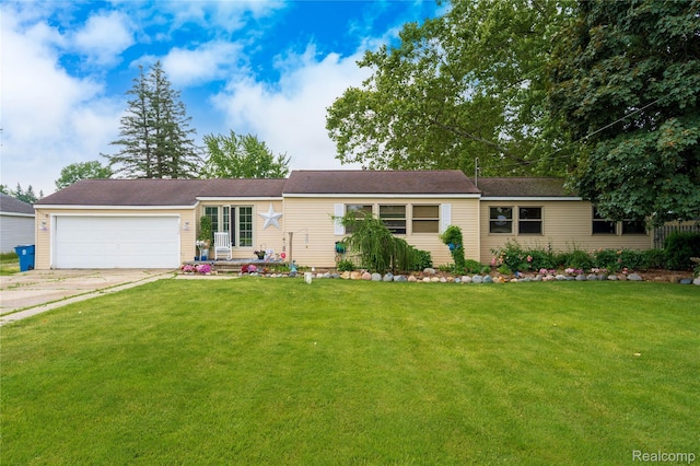 5045 Baldwin Rd, Swartz Creek, MI 48473 - ranch-style home featuring a garage, driveway, and a front yard