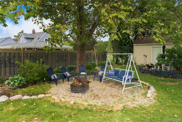 5045 Baldwin Rd, Swartz Creek, MI 48473 - fenced backyard with a fire pit