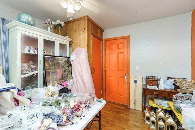 5045 Baldwin Rd, Swartz Creek, MI 48473 - dining space with wood finished floors, ceiling fan, and wood walls