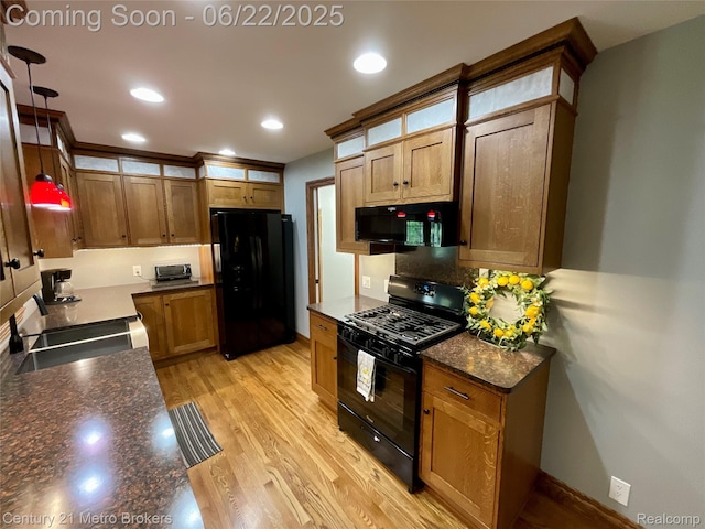 7094 Reid Rd, Swartz Creek, MI 48473 - kitchen featuring black appliances, light wood-type flooring, hanging light fixtures, tasteful backsplash, and recessed lighting