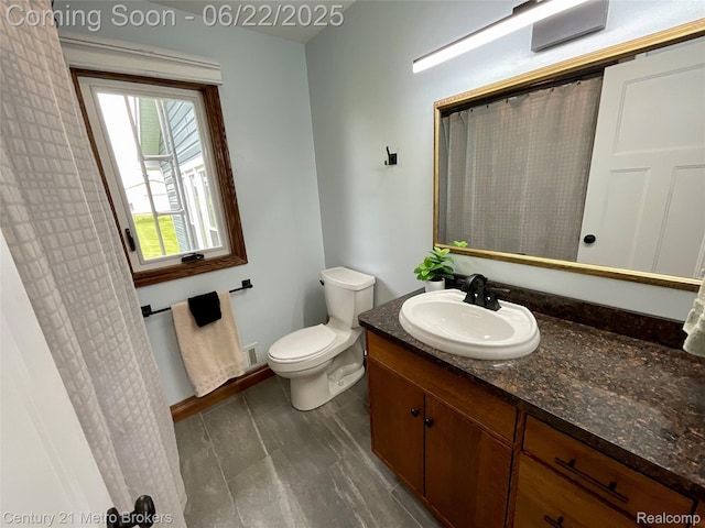 7094 Reid Rd, Swartz Creek, MI 48473 - bathroom featuring vanity and toilet