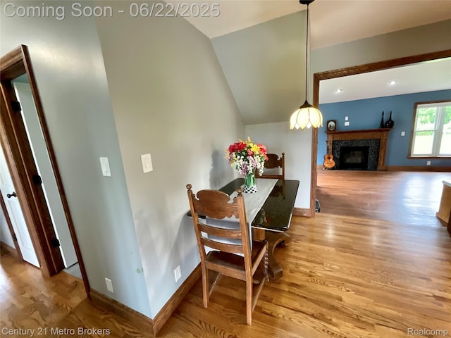 7094 Reid Rd, Swartz Creek, MI 48473 - dining space featuring wood finished floors, a high end fireplace, and recessed lighting