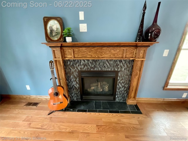 7094 Reid Rd, Swartz Creek, MI 48473 - detailed view of a fireplace and wood finished floors