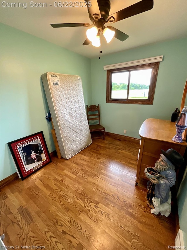 7094 Reid Rd, Swartz Creek, MI 48473 - bedroom with wood finished floors and ceiling fan