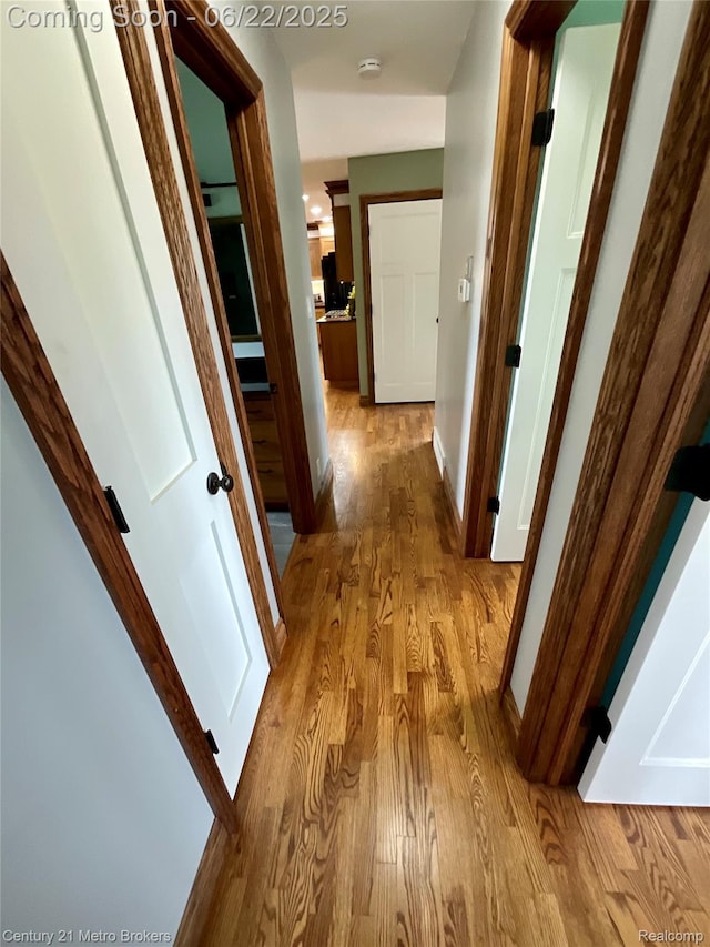 7094 Reid Rd, Swartz Creek, MI 48473 - hall featuring light wood finished floors and baseboards