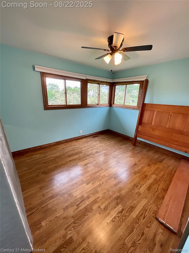 7094 Reid Rd, Swartz Creek, MI 48473 - spare room with wood finished floors and ceiling fan
