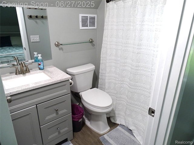 11306 W St, Grand Blanc, MI 48439 - full bathroom featuring vanity, wood finished floors, and a shower with shower curtain