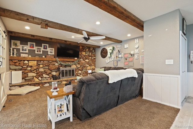 605 Shawnesee, Flushing, MI 48433 - carpeted living area featuring ceiling fan, beamed ceiling, recessed lighting, a wainscoted wall, and a fireplace