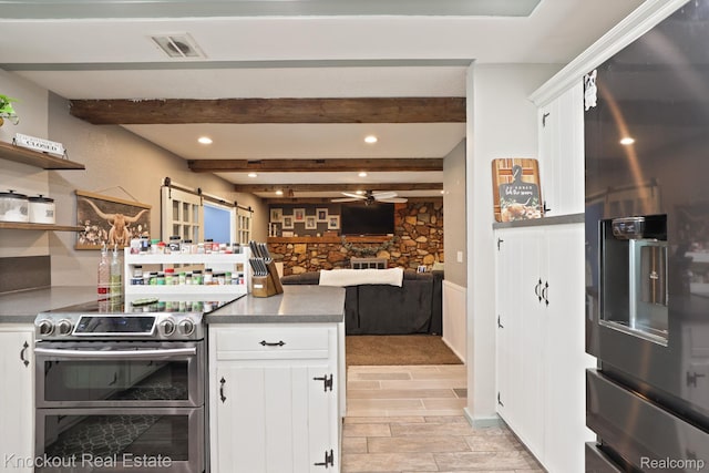 605 Shawnesee, Flushing, MI 48433 - kitchen featuring double oven range, fridge with ice dispenser, ceiling fan, a barn door, and white cabinetry
