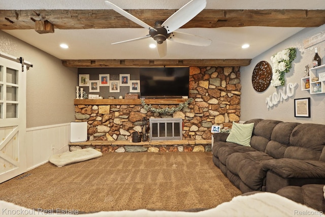 605 Shawnesee, Flushing, MI 48433 - carpeted living area featuring beam ceiling, a barn door, a ceiling fan, a wainscoted wall, and recessed lighting