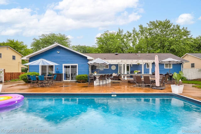 605 Shawnesee, Flushing, MI 48433 - back of property with outdoor dining area and a patio area