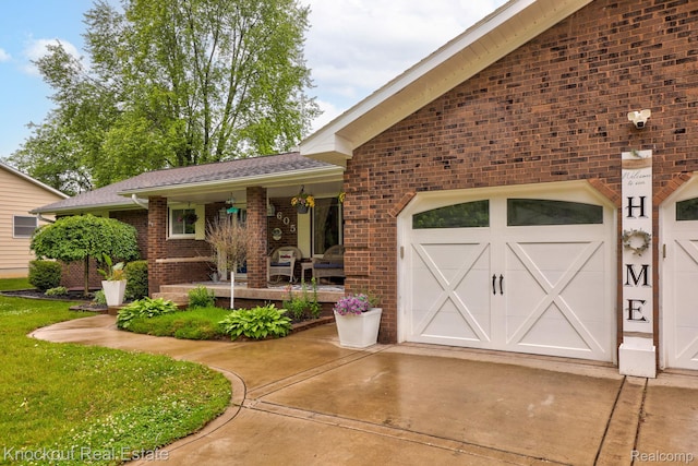 605 Shawnesee, Flushing, MI 48433 - view of front of home featuring brick siding, concrete driveway, covered porch, and a garage