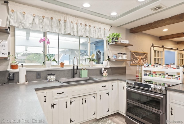 605 Shawnesee, Flushing, MI 48433 - kitchen with double oven range, dark countertops, recessed lighting, open shelves, and white cabinets