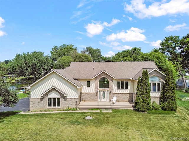 969 Bogie Lake Rd, White Lake, MI 48383 - split foyer home featuring brick siding, a front yard, and a shingled roof