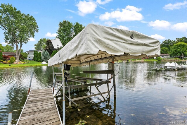 969 Bogie Lake Rd, White Lake, MI 48383 - dock featuring a water view and boat lift