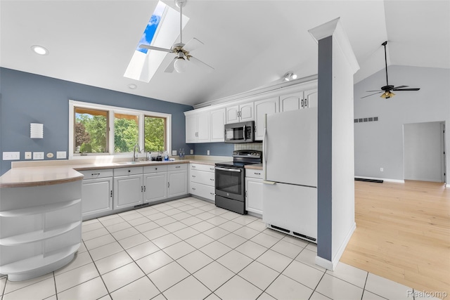 969 Bogie Lake Rd, White Lake, MI 48383 - kitchen featuring stainless steel microwave, a ceiling fan, electric range oven, open shelves, and recessed lighting