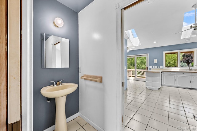 969 Bogie Lake Rd, White Lake, MI 48383 - bathroom with a skylight, tile patterned flooring, and ceiling fan