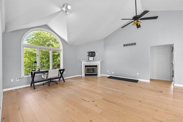 969 Bogie Lake Rd, White Lake, MI 48383 - living room featuring high vaulted ceiling, a fireplace, a ceiling fan, and light wood-style floors