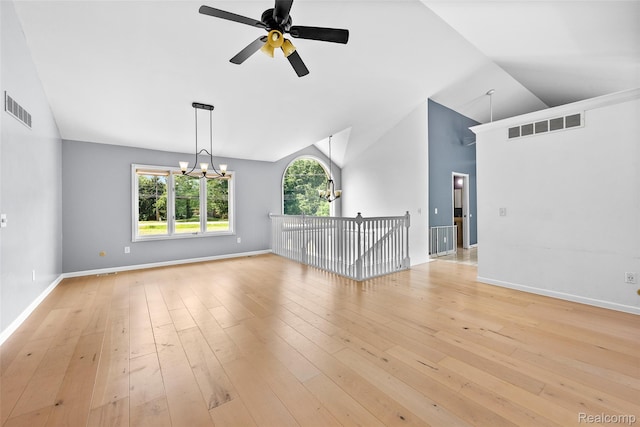 969 Bogie Lake Rd, White Lake, MI 48383 - spare room with a ceiling fan, a chandelier, light wood-style floors, and lofted ceiling