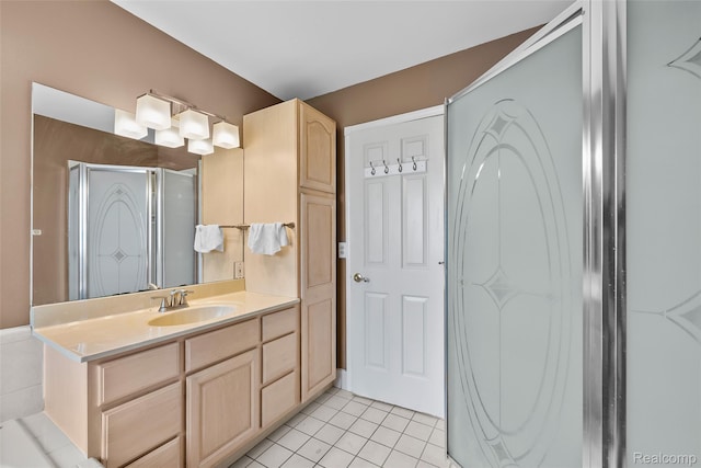 969 Bogie Lake Rd, White Lake, MI 48383 - bathroom featuring tile patterned floors, vanity, and a shower stall