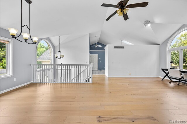 969 Bogie Lake Rd, White Lake, MI 48383 - additional living space with a chandelier, a ceiling fan, lofted ceiling, and light wood-type flooring