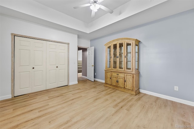 969 Bogie Lake Rd, White Lake, MI 48383 - unfurnished bedroom with wood finished floors, a closet, and ceiling fan