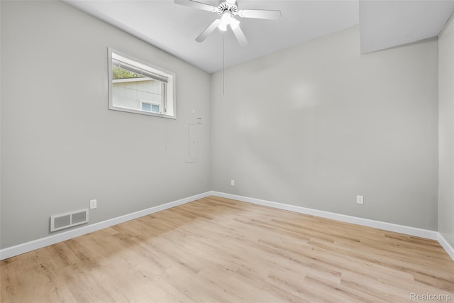 969 Bogie Lake Rd, White Lake, MI 48383 - empty room with a ceiling fan and wood finished floors