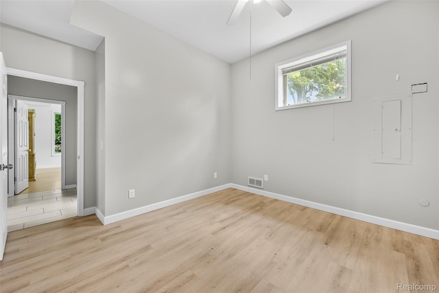 969 Bogie Lake Rd, White Lake, MI 48383 - empty room with plenty of natural light, light wood finished floors, and ceiling fan