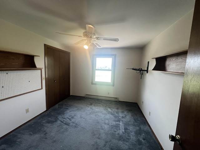 7567 S Bignham Ave, Newaygo, MI 49337 - unfurnished bedroom with a baseboard heating unit, carpet floors, a closet, and a ceiling fan