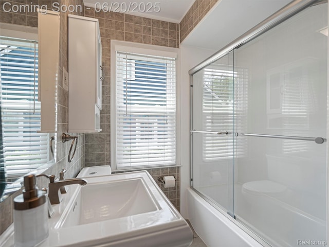 3299 Goodrich St, Ferndale, MI 48220 - bathroom with tile walls, plenty of natural light, and shower / bath combination with glass door