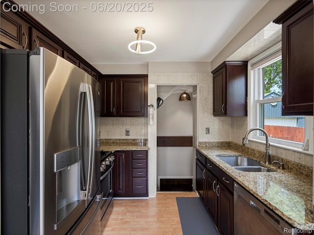 3299 Goodrich St, Ferndale, MI 48220 - kitchen with appliances with stainless steel finishes, dark brown cabinetry, light stone counters, and tasteful backsplash