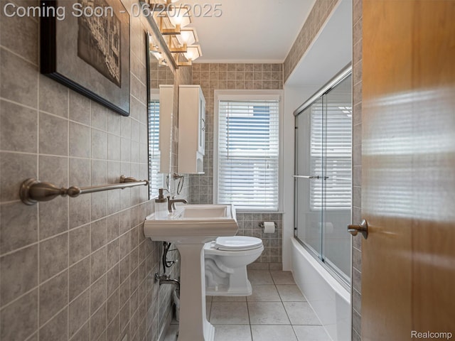 3299 Goodrich St, Ferndale, MI 48220 - full bath featuring tile walls, tile patterned flooring, and bath / shower combo with glass door