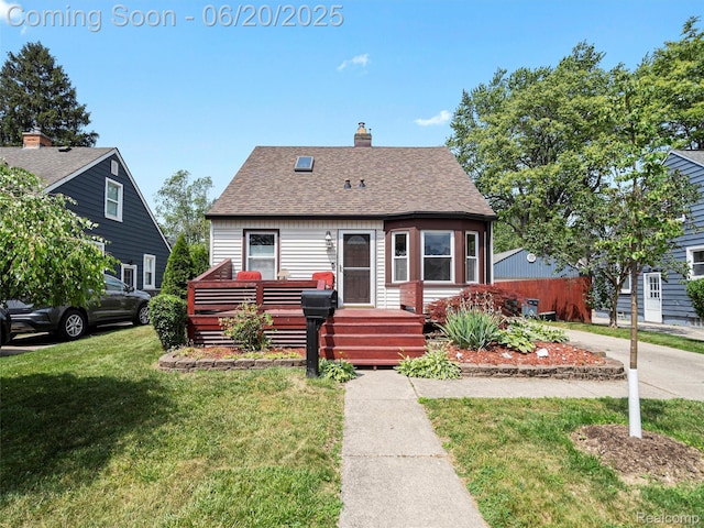 3299 Goodrich St, Ferndale, MI 48220 - view of front of property with a front yard, roof with shingles, and a chimney