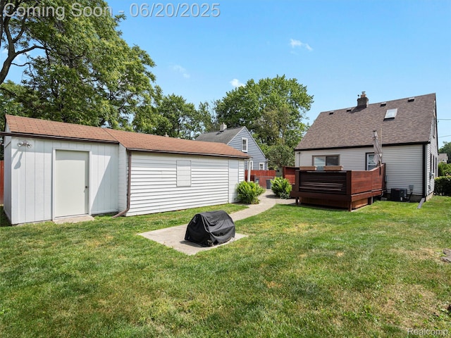 3299 Goodrich St, Ferndale, MI 48220 - rear view of house with a deck, a fire pit, an outdoor structure, and a chimney