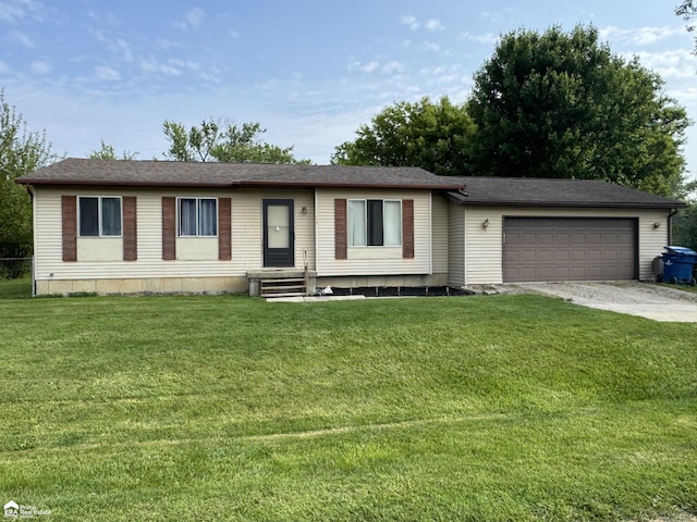1243 Howard St, Mount Morris, MI 48458 - view of front of home featuring a garage, concrete driveway, and a front lawn