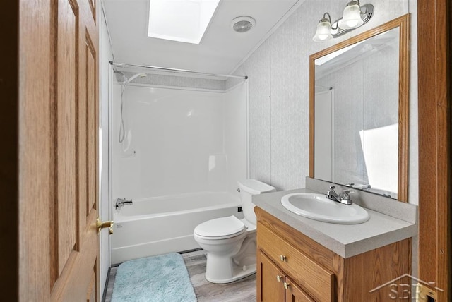 3227 S 11 Mile Rd, Auburn, MI 48611 - full bathroom with a skylight, vanity, washtub / shower combination, wood finished floors, and crown molding