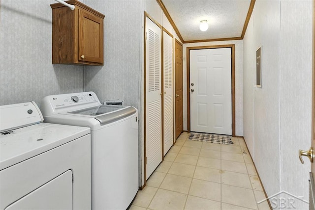 3227 S 11 Mile Rd, Auburn, MI 48611 - washroom with cabinet space, washing machine and clothes dryer, ornamental molding, light tile patterned flooring, and a textured ceiling