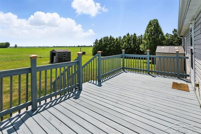 3227 S 11 Mile Rd, Auburn, MI 48611 - wooden terrace featuring a storage unit, a yard, and a view of countryside