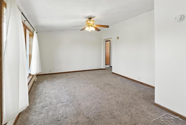 3227 S 11 Mile Rd, Auburn, MI 48611 - carpeted empty room with a smoke detector and a ceiling fan