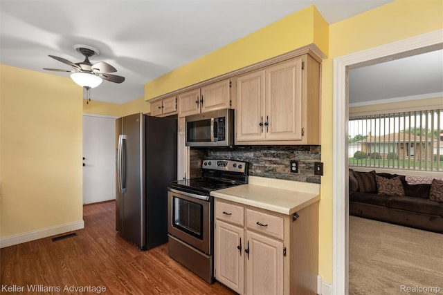 9286 Dudley St, Taylor, MI 48180 - kitchen with stainless steel appliances, light brown cabinets, tasteful backsplash, light countertops, and ceiling fan