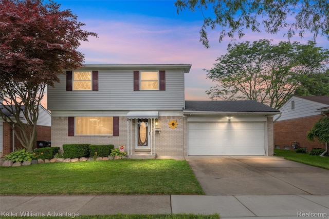 9286 Dudley St, Taylor, MI 48180 - view of front of house with brick siding, a garage, driveway, and a yard