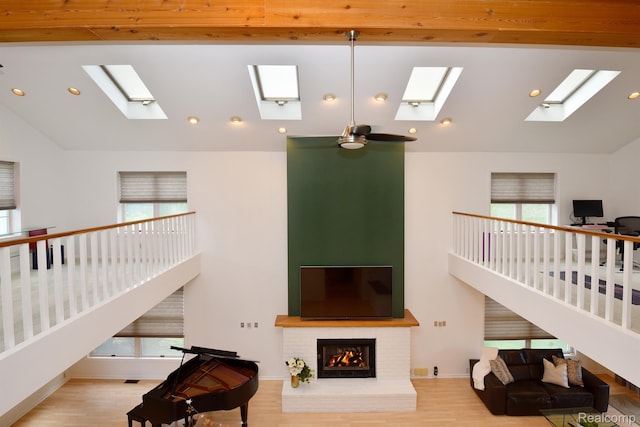 5100 Kings Gate Way, Bloomfield Hills, MI 48302 - living area with a skylight, plenty of natural light, wood finished floors, recessed lighting, and high vaulted ceiling