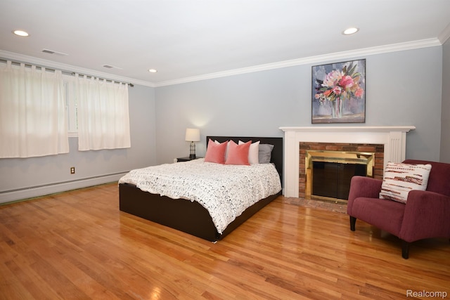 5100 Kings Gate Way, Bloomfield Hills, MI 48302 - bedroom featuring light wood-style floors, crown molding, recessed lighting, a fireplace, and baseboard heating